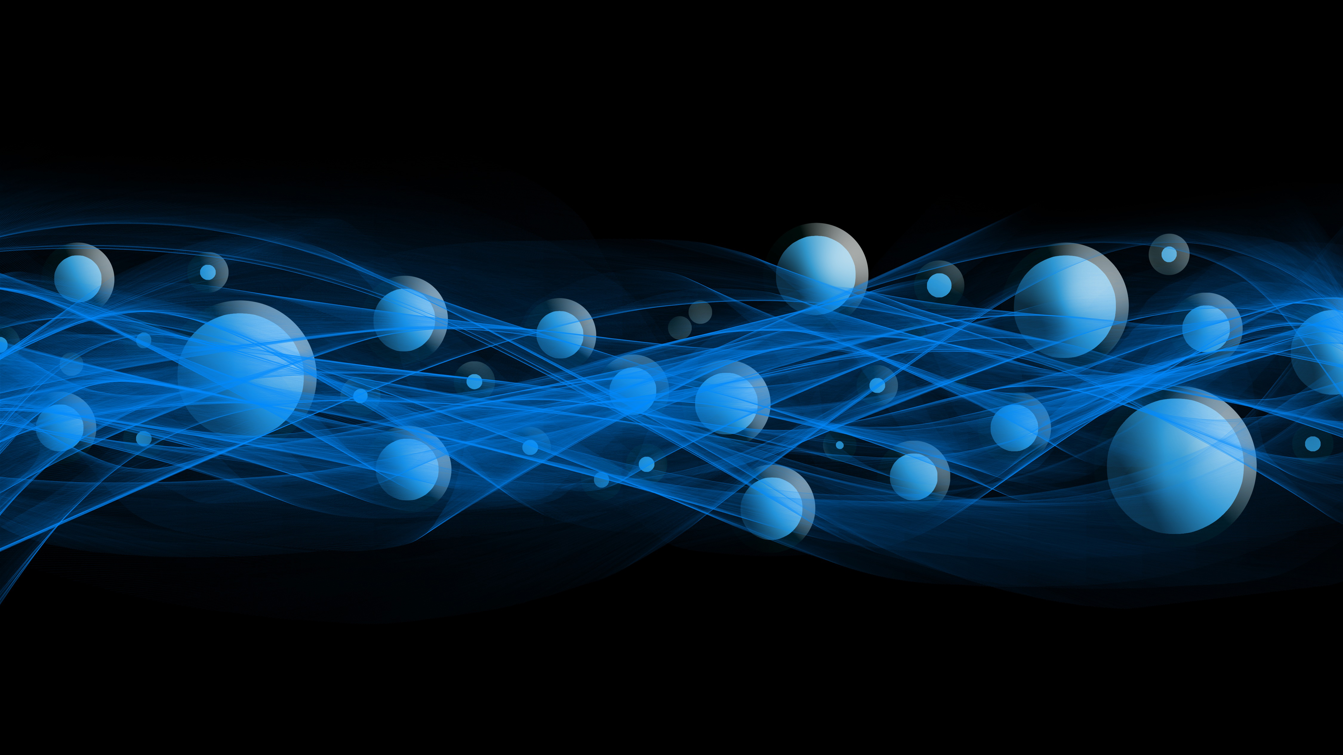 Blue particle waves and orbiting spheres on a dark field